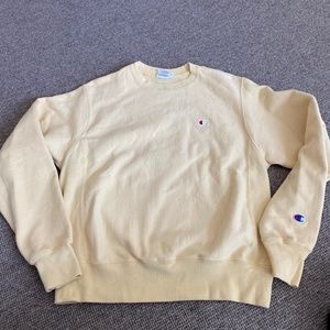 Small pale yellow champion sweatshirt